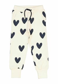 Vita sweatpants med stora marinblå hjärtan, elastisk midja med sn�örning, sidofickor och åtsittande mudd vid anklarna.