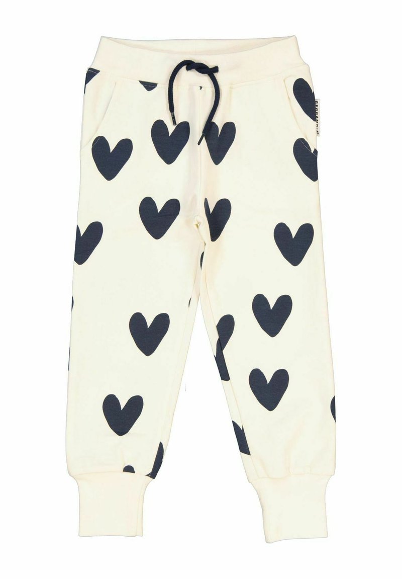 Vita sweatpants med stora marinblå hjärtan, elastisk midja med snörning, sidofickor och åtsittande mudd vid anklarna.