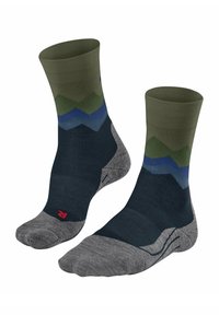 Un paio di calzini a metà polpaccio con punte e talloni grigi, piedi blu navy e motivi a zig zag verdi, blu e teal vicino alla parte superiore.