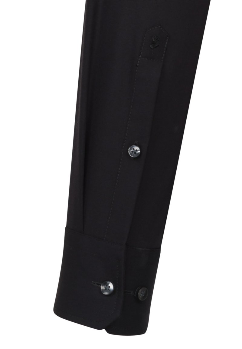 Schwarzes Langarmhemd mit einem spitzen Design an den Manschetten, zwei schwarzen Knöpfen und dekorativen Nähten mit einem geprägten Blumenemblem.