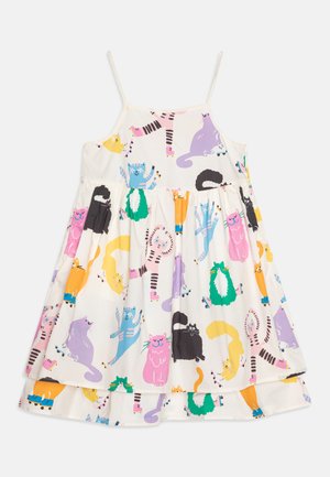 Weißes Baumwollkleid mit verstellbaren Trägern, das mit einem verspielten Druck von bunten Cartoon-Katzen in verschiedenen Posen versehen ist. Ausgestellter, knielanger Schnitt.