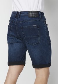 Koroshi STRECTH  STRECT - Kratke hlače od trapera - azul osc   dark blue