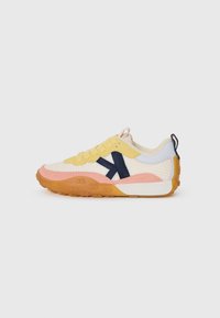 Multicolored sneaker featuring a mesh upper in yellow and cream, with pink and navy accents. Textured sole in orange with a patterned tread.