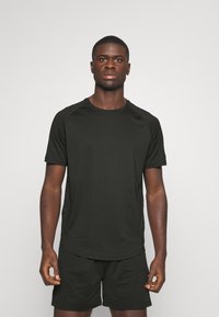 ICANIWILL STRIDE RAGLAN - Spordi T-särk - black
