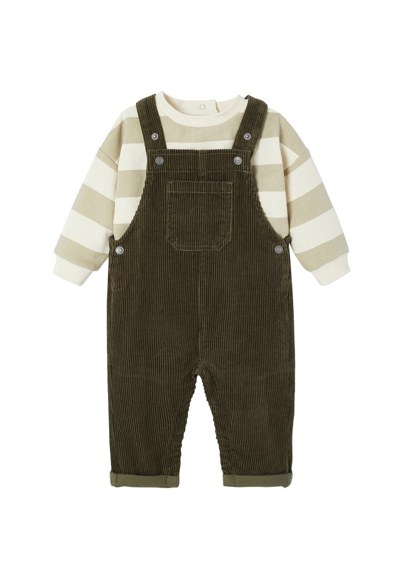 Green corduroy overalls with a front pocket, paired with a beige and olive striped long-sleeve shirt. Features button closures and rolled cuffs.