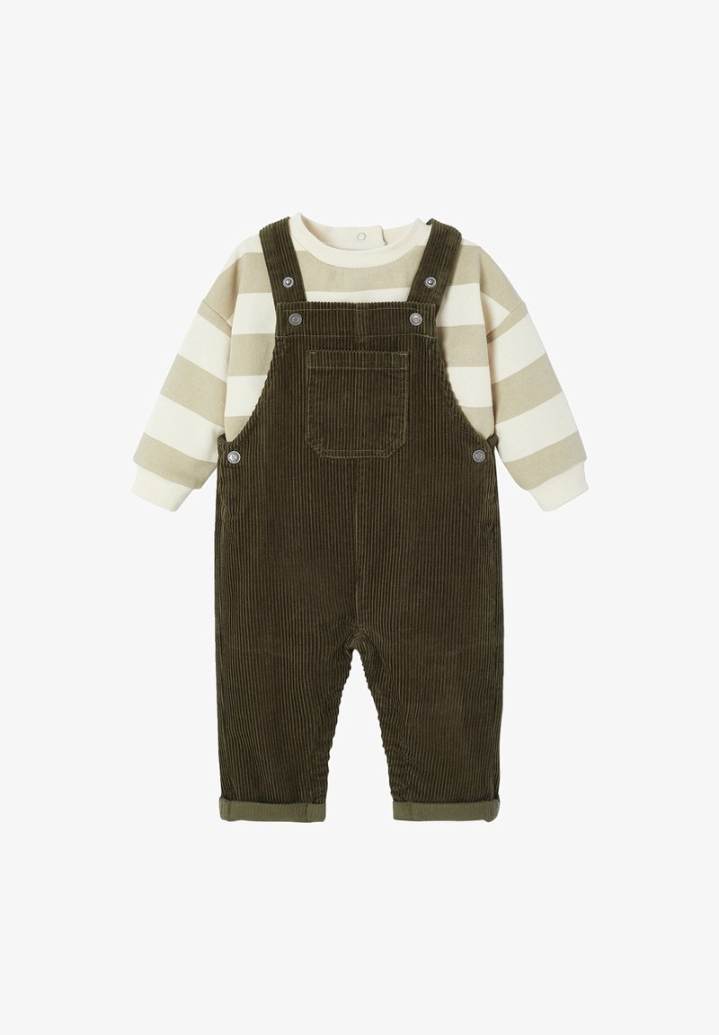 Green corduroy overalls with a front pocket, paired with a beige and olive striped long-sleeve shirt. Features button closures and rolled cuffs.