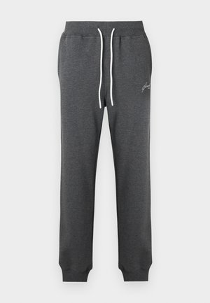Donkergrijze sweatpants van een katoenmix, voorzien van een trekkoord in de taille met witte accenten en geribbelde boorden. Subtiel geborduurd logo aan de zijkant.