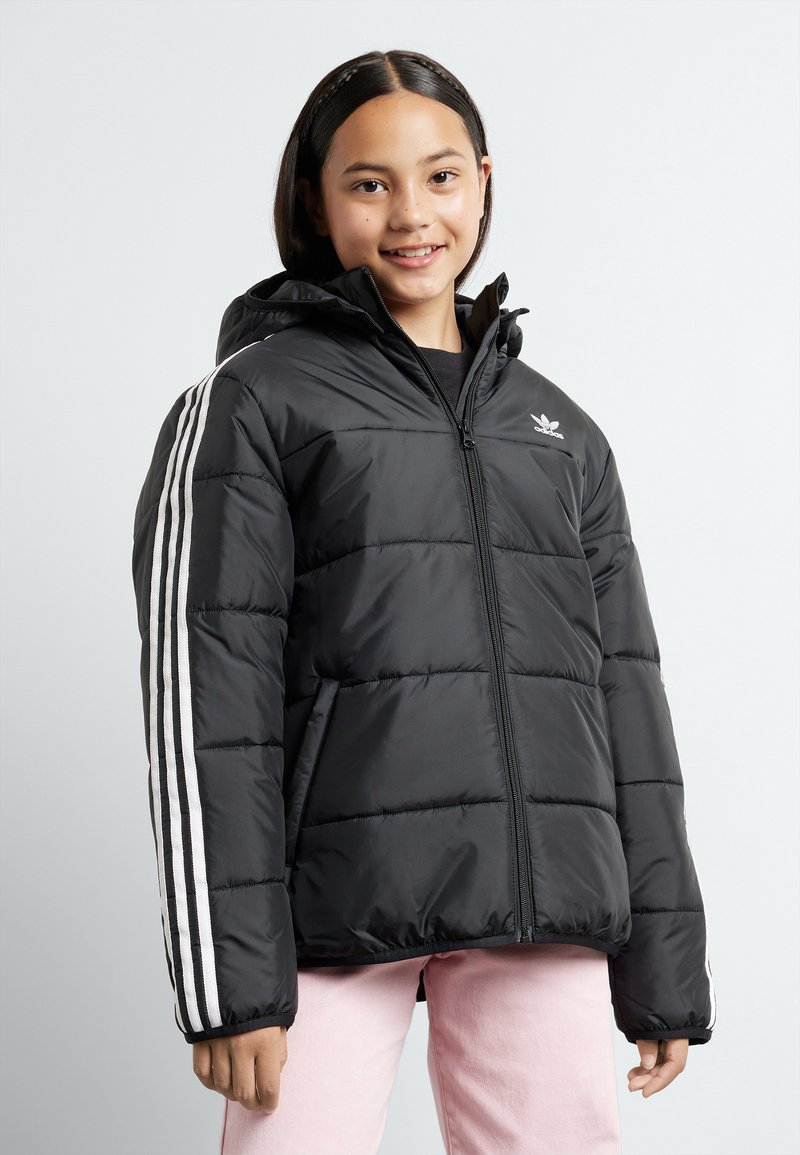 Black puffy jacket with a hood, featuring white three-stripe accents on sleeves and a small logo on the chest. Zippered front, quilted texture.