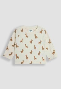 Lange mouwen shirt in cream katoen, met een herhaald giraffe patroon in bruin. Inclusief drukknopen op de schouder voor gemakkelijke aankleding.