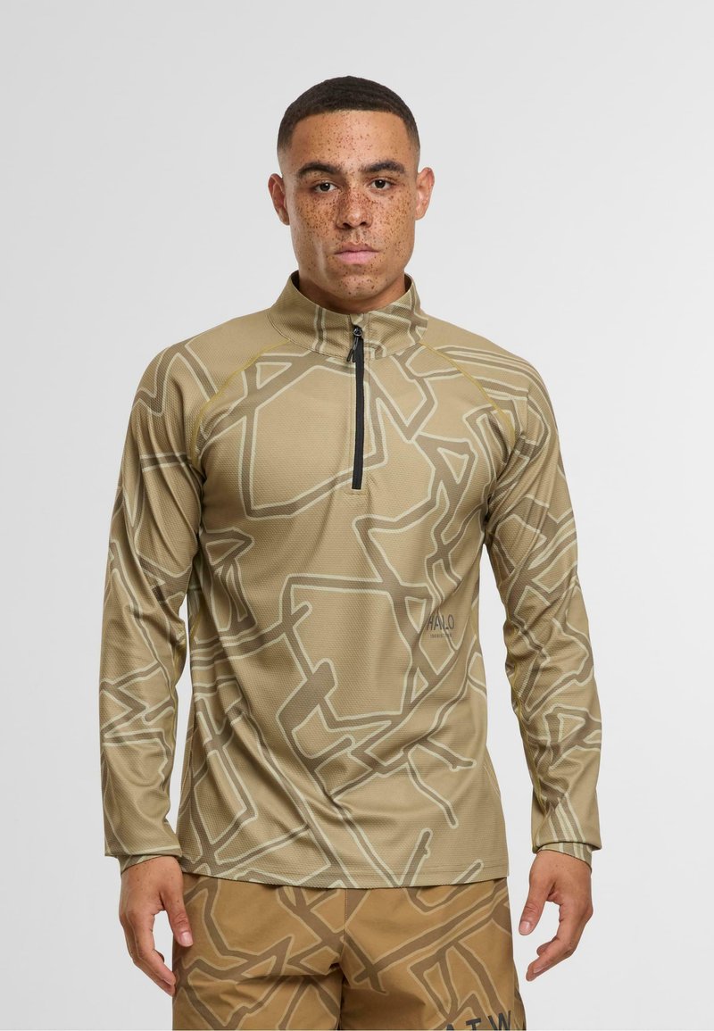 Hellbraunes Zip-Up Langarmoberteil mit einem geometrischen Muster in einer helleren Nuance. Hergestellt aus strukturiertem Stoff mit rundem Kragen.