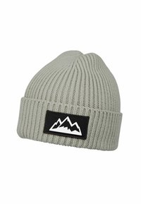 Light gray ribbed knit beanie with a folded cuff featuring a black patch with a white mountain logo.