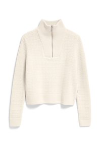 Maglione bianco lavorato a maglia con colletto alto e zip a un quarto. Motivo testurizzato con punti in rilievo, taglio cropped e polsini e orlo a coste.