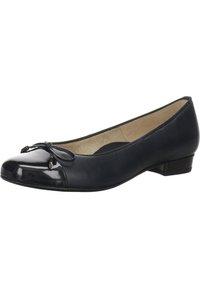 Ballerines noires avec un bout en vernis et un accent en nœud. Tige en cuir souple et un petit talon empilé. Texture lisse sur l'ensemble.