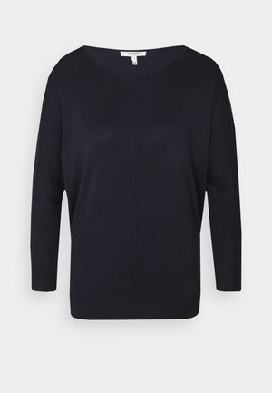 Dunkelblauer, leichter Strickpullover mit weiter Ausschnitt, langen Ärmeln und gerippten Bündchen. Sanfte Textur und lockere Passform.