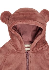 Fleece zip-up hoodie in dusty rose color, featuring bear ears on the hood, soft texture, and contrasting inner lining.