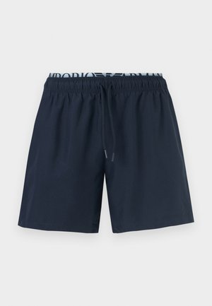 Marineblaue Herren-Badeshorts mit elastischem Bund und schwarzem Kordelzug, sichtbares weißes Markenfutter am oberen Rand.
