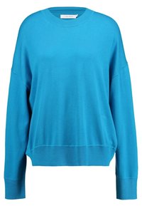 Leichter türkisfarbener Pullover mit lockerem Schnitt, rundem Ausschnitt, überschnittenen Schultern sowie gerippten Bündchen und Saum. Hergestellt aus weichem Stoff.