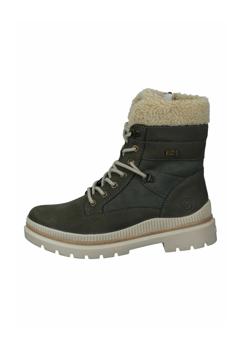 Botas de tobillo con cordones en cuero verde oscuro con un forro esponjoso de color crema, suela de goma beige y ojales de metal. Detalles en superficie texturizada.