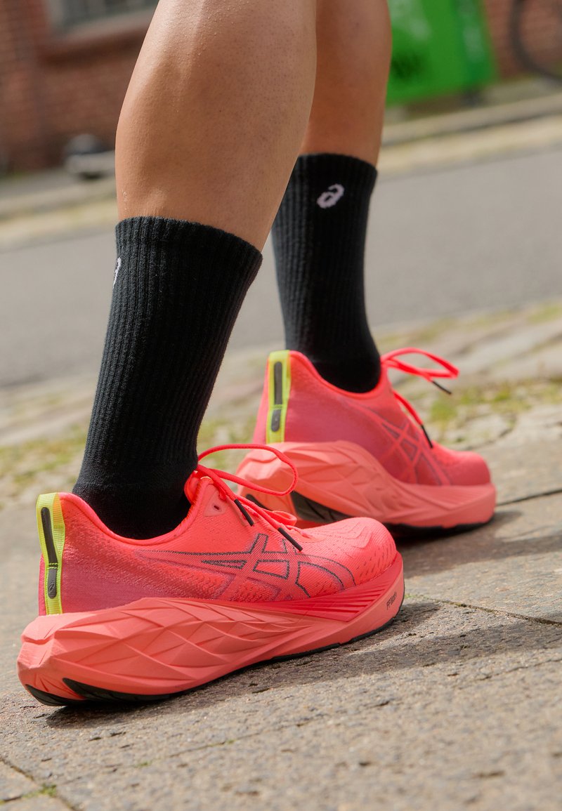 ASICS NOVABLAST 4 - Road running shoes - sunrise red/true red/red 
