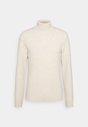 Maglione a collo alto beige realizzato in morbido materiale a maglia, con maniche lunghe e colletto aderente. Design semplice senza motivi o accenti.