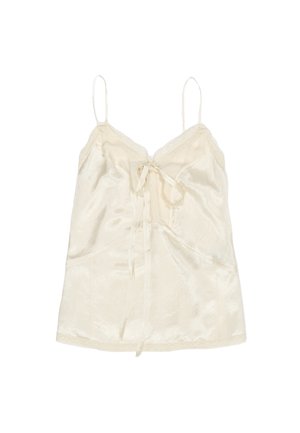 Zijde camisole in crème, met verstelbare bandjes, een kantafwerking langs de halslijn en een strikdetail in het midden. Gladde textuur met een subtiele glans.