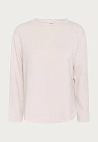 T-shirt à manches longues beige clair avec col rond, tissu simple et lisse, sans motifs ni logos visibles.