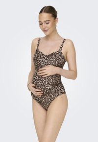 Kupaći kostim za trudnice s uzorkom leoparda, s dizajnom u obliku slova V, podesivim naramenicama i prilagodljivim siluetom u svijetlosmešnim i crnim tonovima.