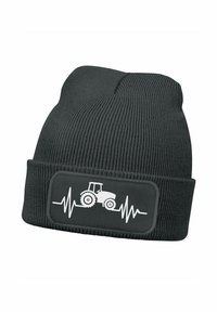 Black knit beanie with ribbed texture, featuring a white tractor graphic on a rectangular patch with a heartbeat line design.
