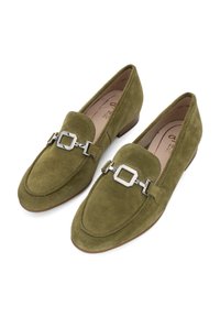 Olive green suede loafers with a square metal buckle accent and a low, rectangular heel. Smooth texture and rounded toe design.