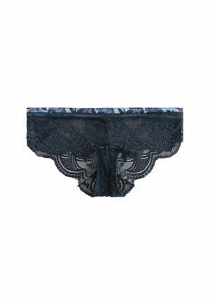 Culottes en dentelle de couleur bleu marine foncé avec une ceinture à motifs floraux, des bords festonnés et un mélange de matériaux transparents et opaques.