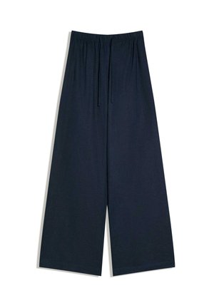 Temno modre široke hlače z elastičnim pasom in vrvico, položene na ravno površino na belem ozadju.