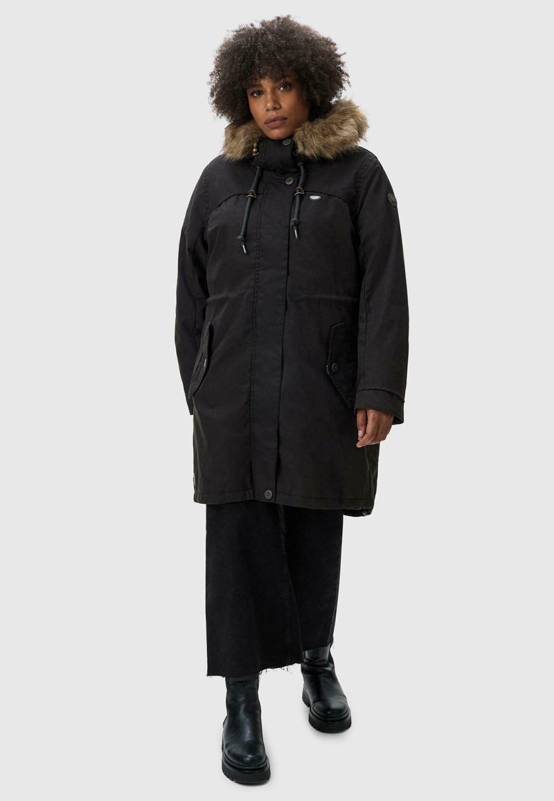 Black parka coat with fur-lined hood, featuring drawstrings, side pockets, and a loose fit, complemented by a textured surface.