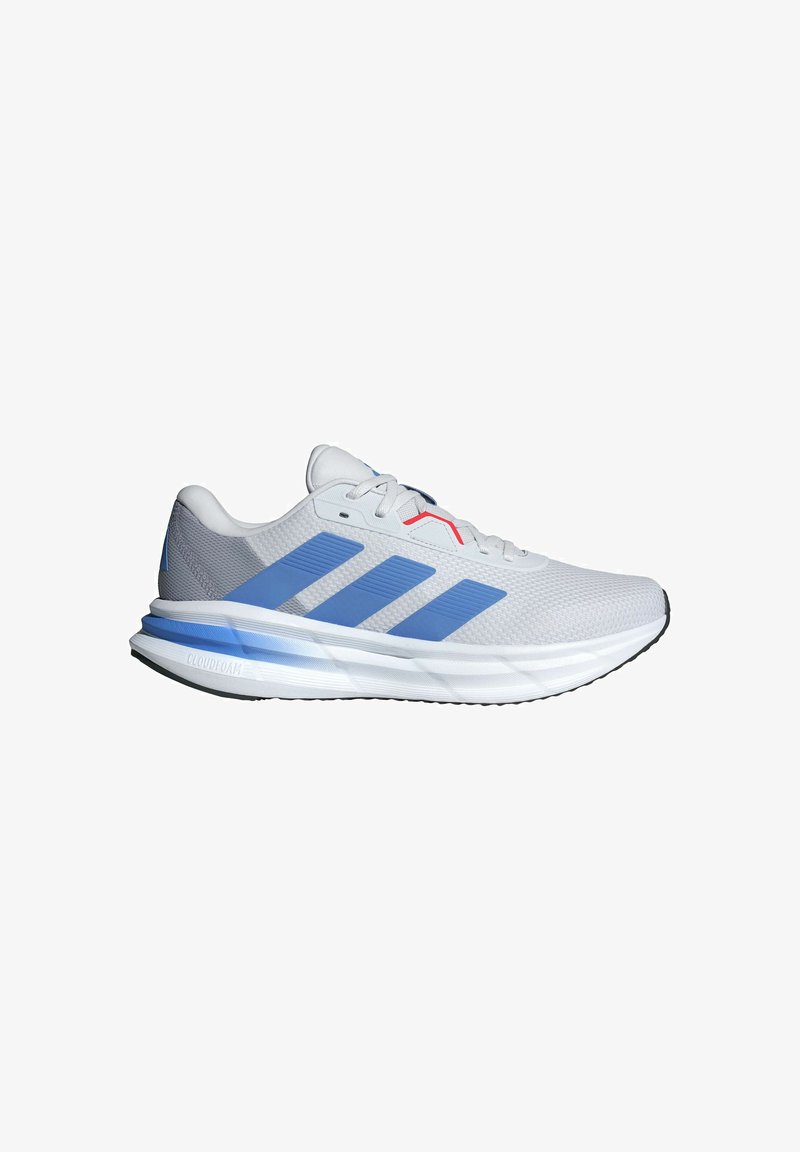 Light gray athletic shoes with blue accents, mesh upper, three horizontal stripes, and a cushioned sole marked "CLOUDFOAM."