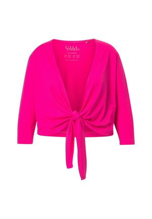 Krótki rękaw, jasnoróżowa bluzka wrap z wiązaniem z przodu i dekoltem w serek. Wykonana z miękkiego, elastycznego materiału.