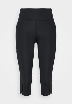 Leggings pretos capri feitos de material elástico, com uma cintura alta, fendas laterais e elementos de design minimalistas.