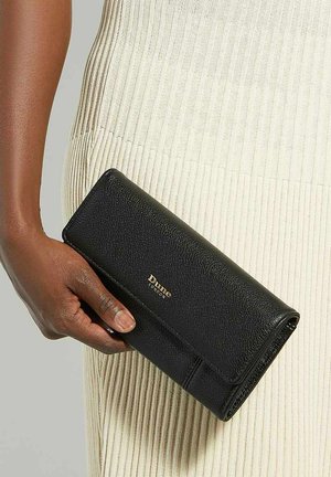 Black leather wallet with a textured finish, featuring a gold logo. The wallet has a long rectangular shape and is held in a person's hand.