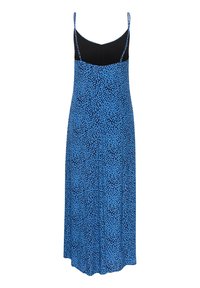Robe bleue avec un motif de petits pois bleu clair sur un fond bleu foncé. Elle possède des bretelles fines réglables et une silhouette fluide.