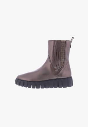 Brown leather ankle boot with elastic side panels, textured accents, and a chunky black rubber sole. Smooth finish with a modern design.