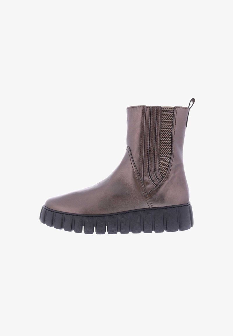 Brown leather ankle boot with elastic side panels, textured accents, and a chunky black rubber sole. Smooth finish with a modern design.