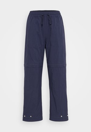 Navy blue lightweight pants with an elastic waist and drawstring. Features snap buttons at the ankle and contrast stitching along the seams.