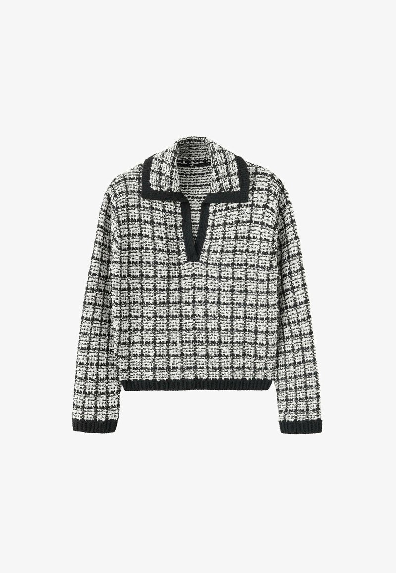 Pull en maille à carreaux noir et blanc avec manches longues, col en V et bordure noire au col, aux poignets et à l'ourlet.