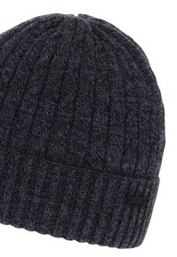 Knit beanie in dark navy blue, featuring a ribbed texture and a fold-up cuff. Material appears soft with a woven pattern.