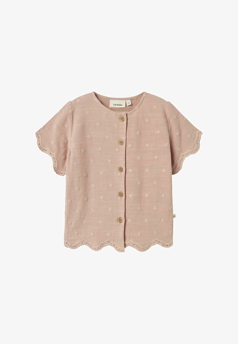 Blusa rosa a maniche corte con orlo scallop, tessuto testurizzato con motivi floreali e bottoni in legno lungo il davanti.