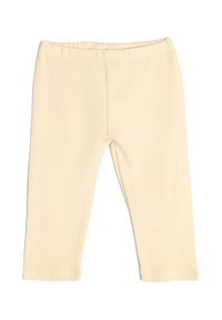 Leggings de canalé de color beige claro con una cinturilla elástica, diseño ajustado y sin herrajes ni acentos visibles. Textura suave y corte hasta los tobillos.
