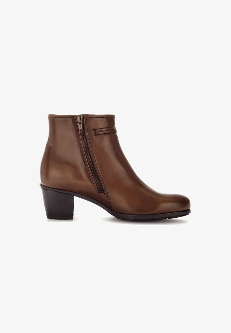Bottine en cuir marron avec fermeture éclair latérale, petit talon bloc et bout rond lisse, présentée de profil sur fond blanc.