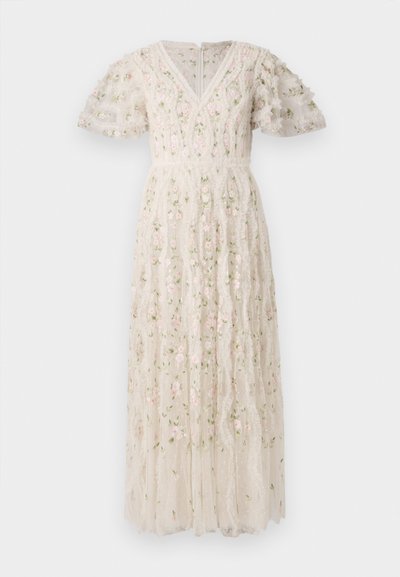 Valkoinen broderad klänning i tyg med korta puffärmar, V-ringning, blommönster i rosa och grönt samt volangdesign på kjolen.