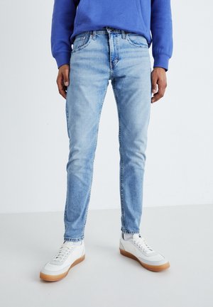 Jeans Tapered Fit - light-blue denim