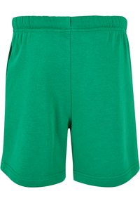 Grønne bomullsshorts med elastisk midjebånd, med en glatt tekstur, rett snitt og ingen synlige lommer eller mønstre.