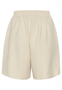 Shorts beige en lin avec une taille élastique. Le tissu a une apparence texturée, légère et s'arrête au-dessus du genou.