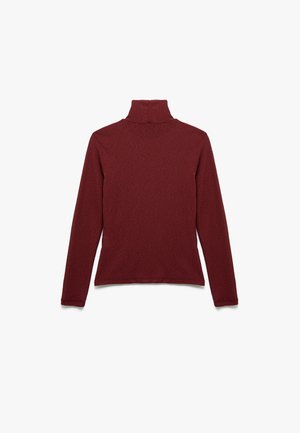 Maglione a collo alto bordeaux in un morbido tessuto testurizzato. Presenta maniche lunghe e una silhouette aderente con un colletto alto.